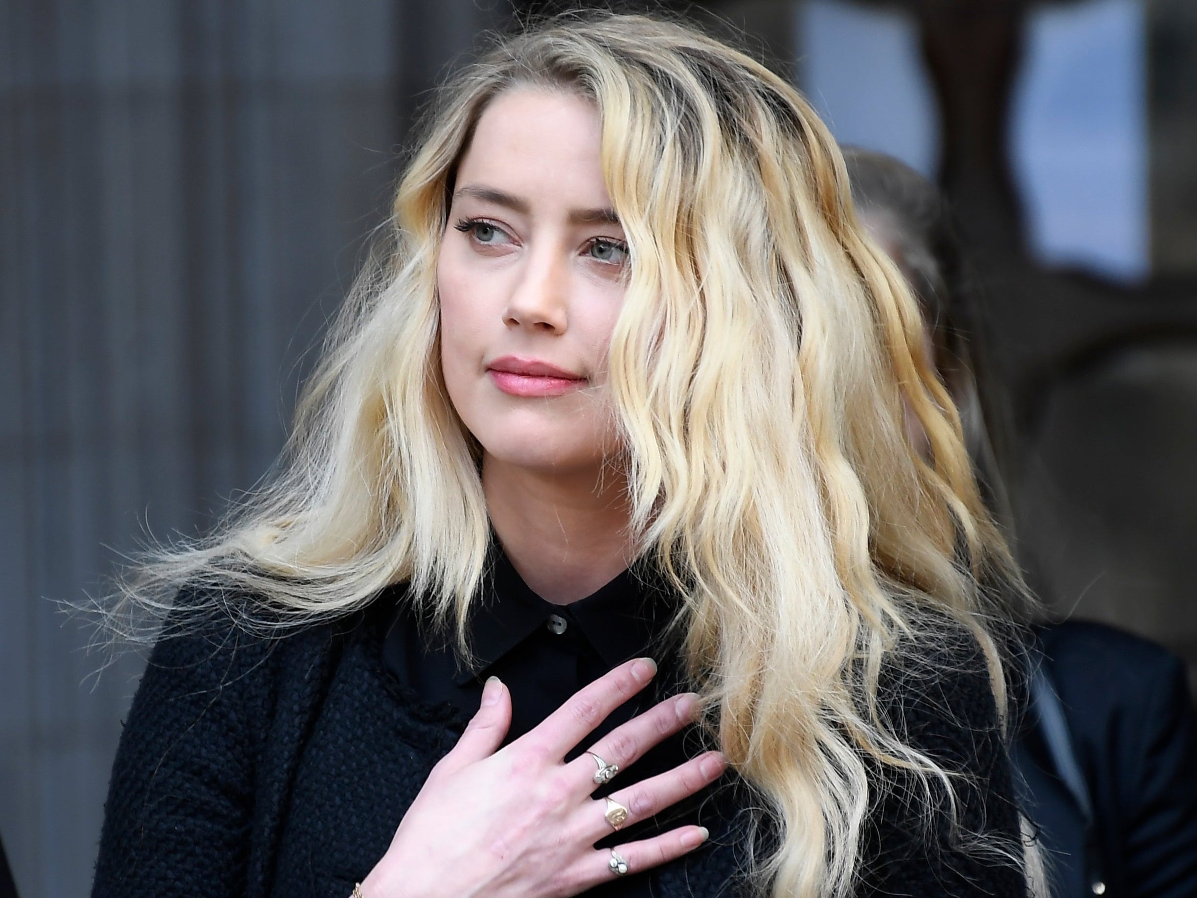 American actress Amber Heard, former wife of actor Johnny Depp, gives a statement outside the High Court in London