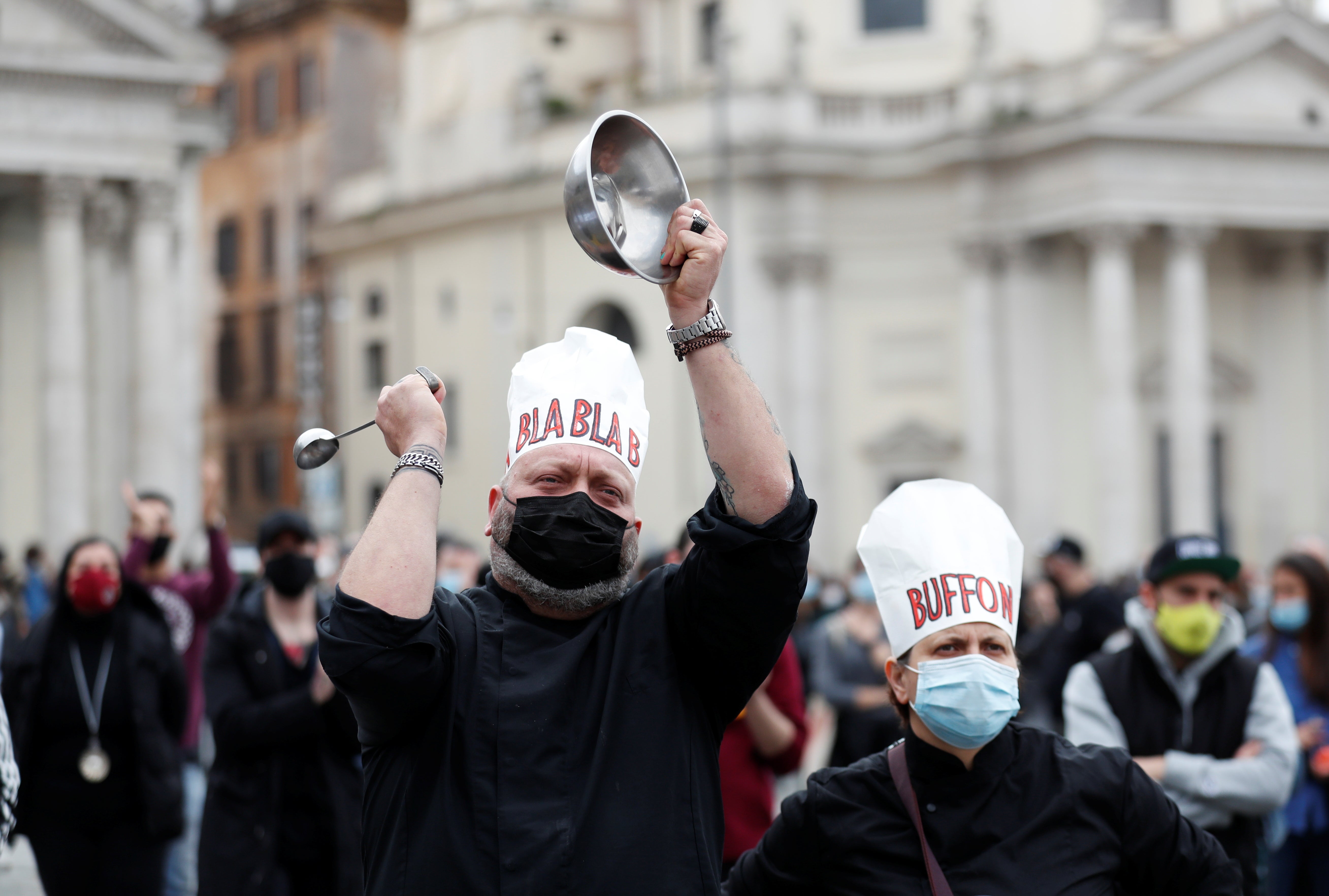 Italian restaurant and bar workers gather in Piazza del Popolo to protest against the government's social distancing rules