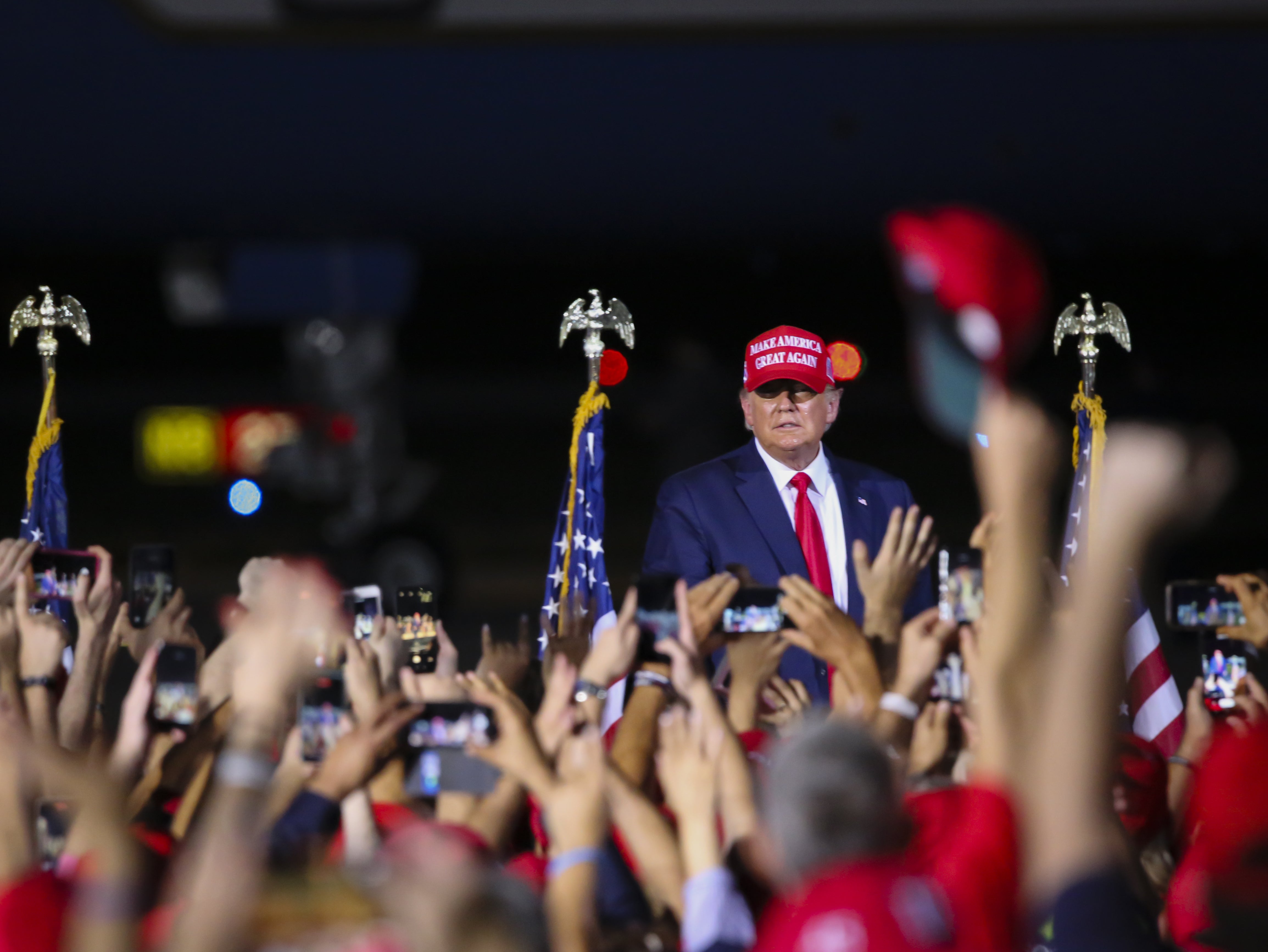 US President Donald Trump holds a rally to address his supporters at Miami-Opa Locka Executive Airport in Miami, Florida