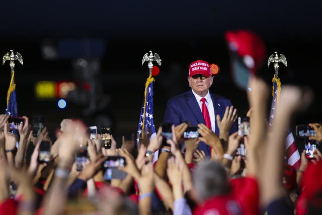 US President Donald Trump holds a rally to address his supporters at Miami-Opa Locka Executive Airport in Miami, Florida