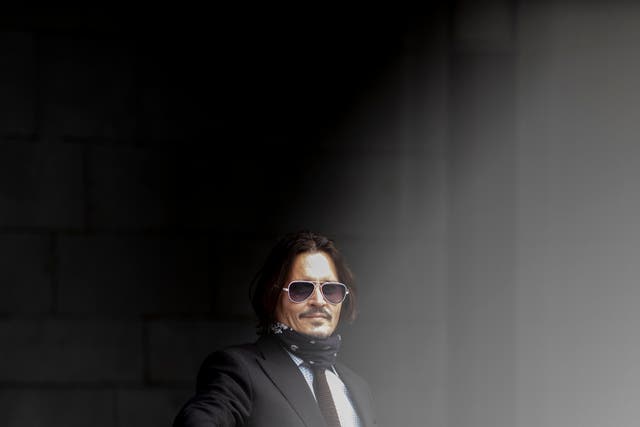 <p>Johnny Depp, pictured at the Royal Courts of Justice in July, has lost his libel case against the Sun newspaper</p>