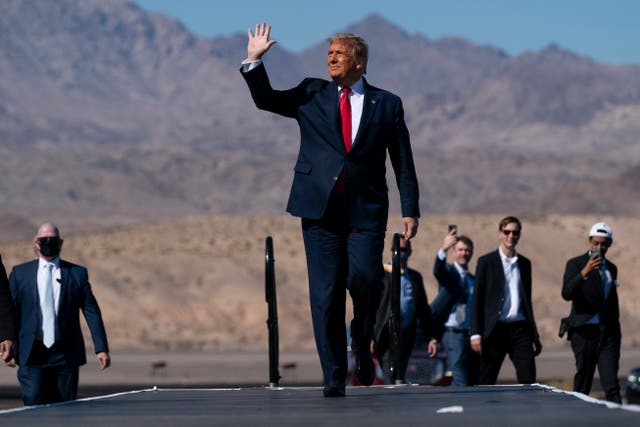Donald Trump waves to supporters in Bullhead City, AZ