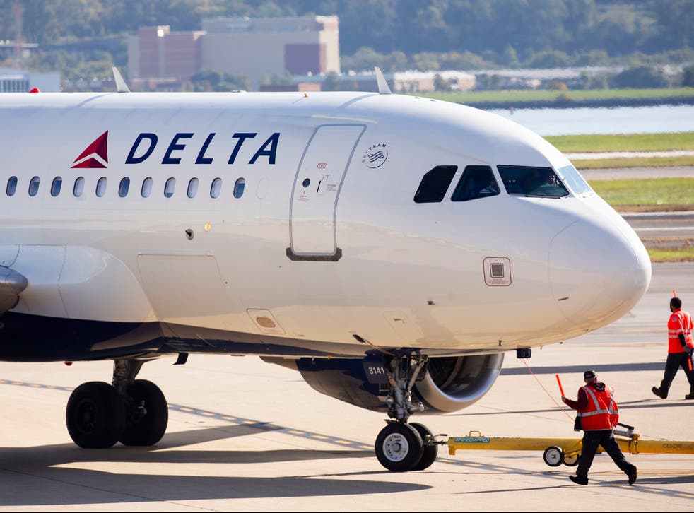  A Delta plane taxis on the tarmac at Ronald Reagan Washington National Airport in Arlington, Virginia
