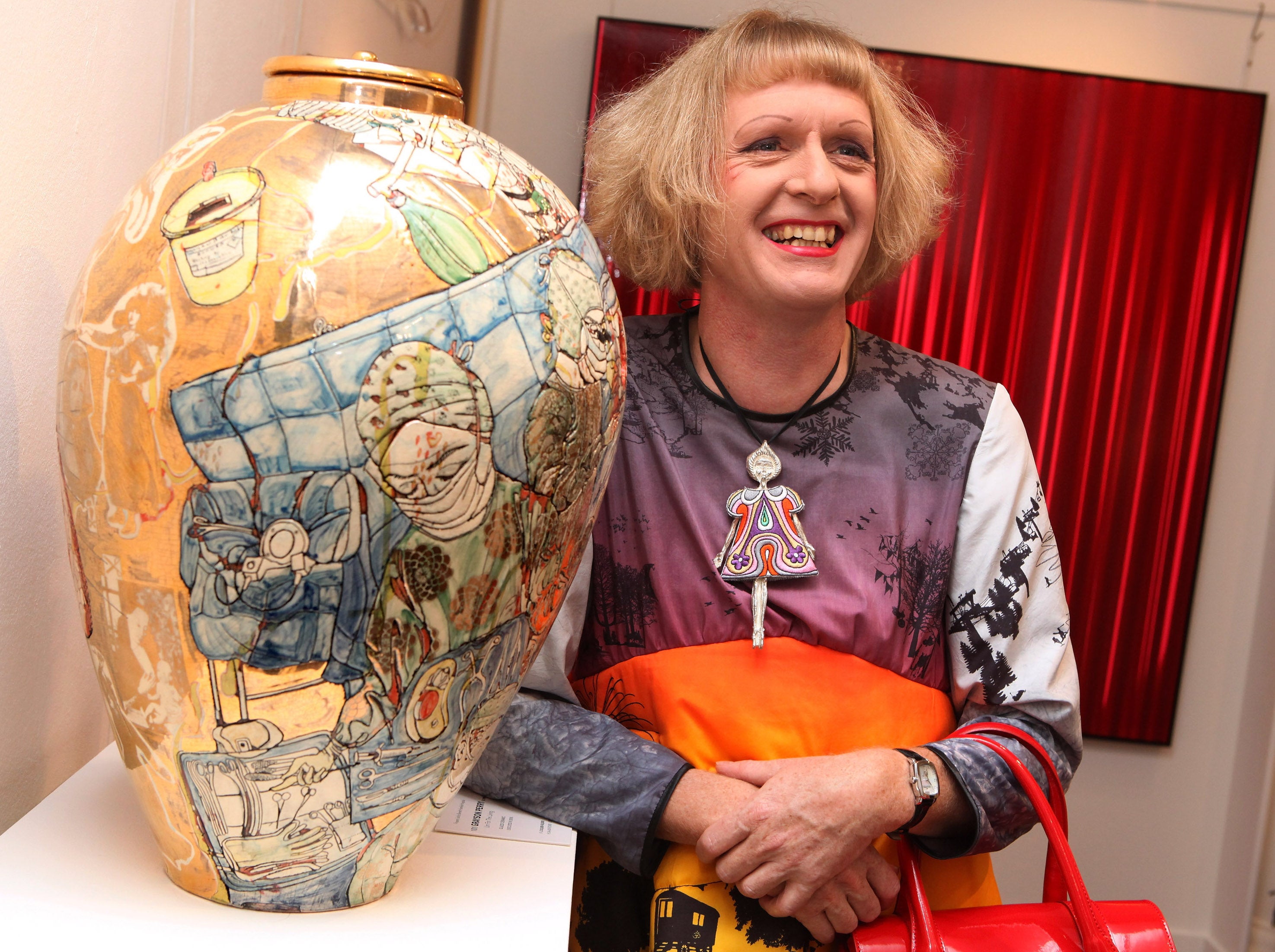 Grayson Perry with one of his pots at Sotheby’s auction house, 2009