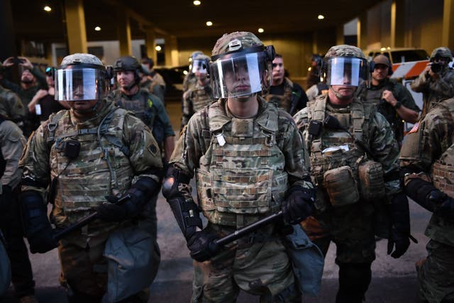 National Guard troops stand ready in Tulsa, Oklahoma where Donald Trump holds a campaign rally at the BOK Center on June 20, 2020. Across the U.S., National Guard members are prepared to deploy in the event of unrest in response to the U.S. election.
