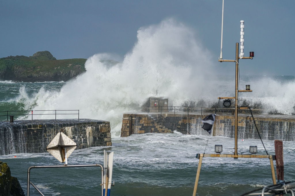 Waves cased by Storm Ellen strike the National Trust-owned harbour on August 21, 2020 at Mullion Cove, Cornwall, United Kingdom.