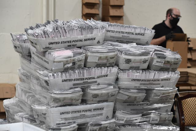 <p>Mail-in ballots in their envelopes await processing at the Los Angeles County Registrar Recorders’ mail-in ballot processing center in Pomona, California, on 28 October</p>