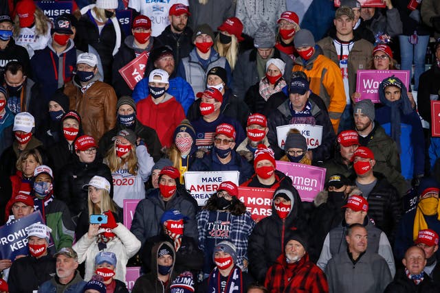 <p>Trump supporters at a rally held by the president in Michigan yesterday</p>