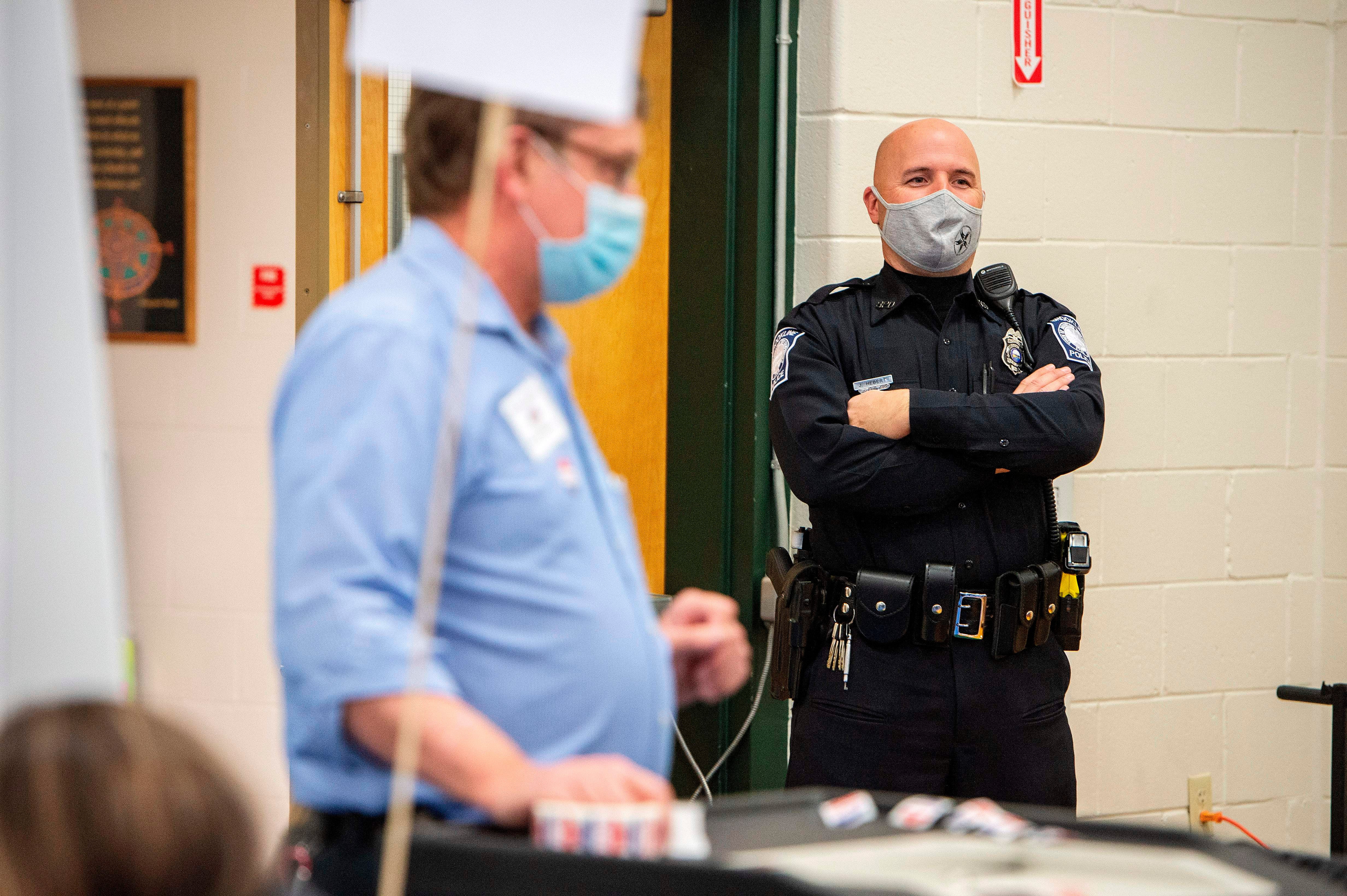 Police arrested an armed Trump supporter in North Carolina who was loitering at a polling site after being banned from there earlier in the day.