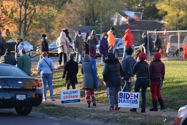 Voters wait on line to cast their ballots on Election Day on November 3, 2020 at Jennings Senior High School in St Louis, Missouri.  