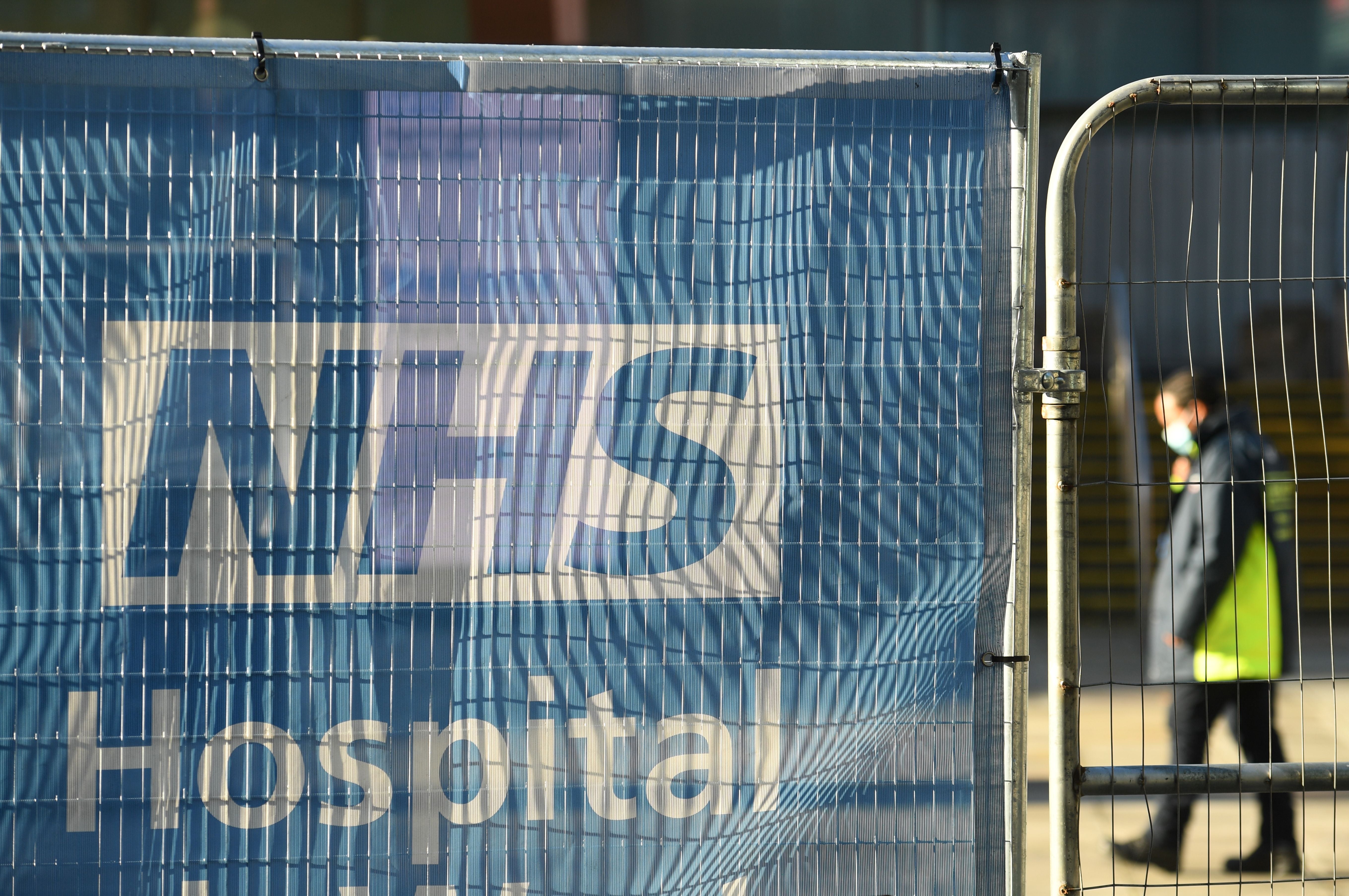 Signage is seen outside the NHS Nightingale Hospital
