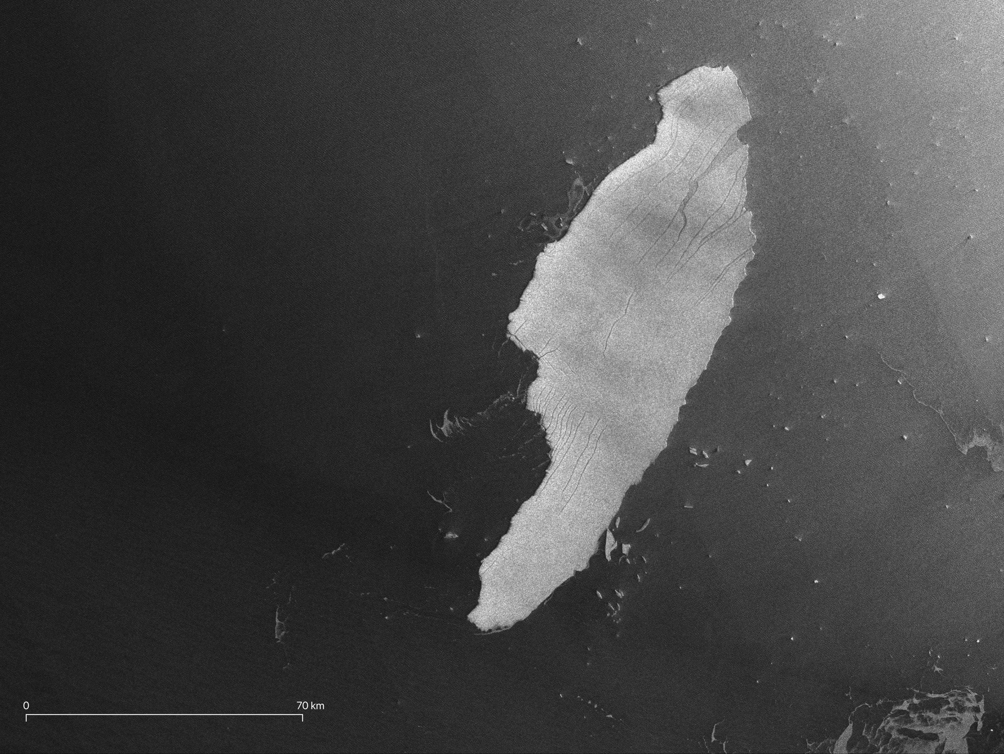 Satellite photograph of iceberg A68 taken by the Copernicus Sentinel-1 satellite, showing trail of smaller pieces of ice