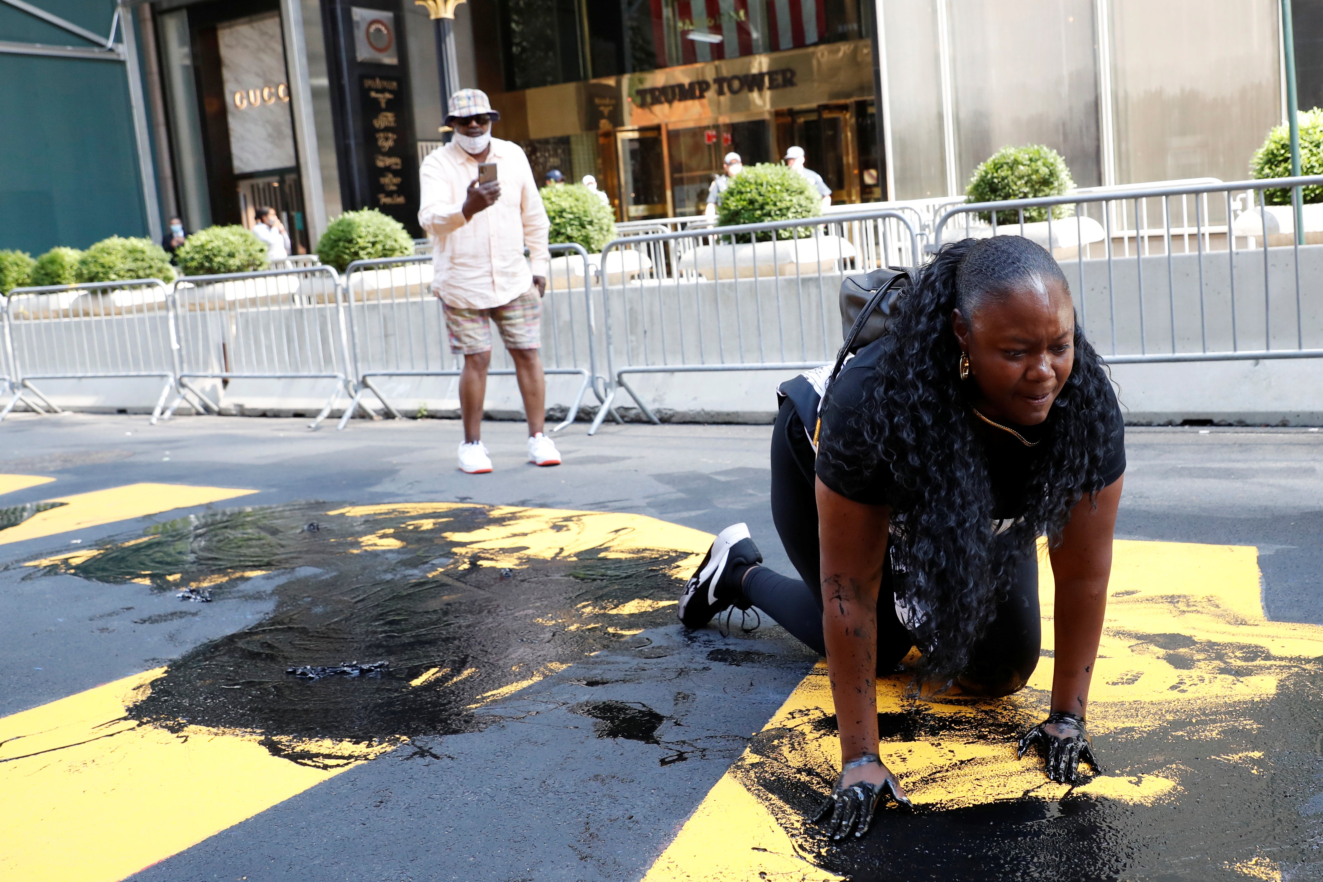 Bevelyn Beatty defacing the BLM mural outside Trump Tower on 18 July