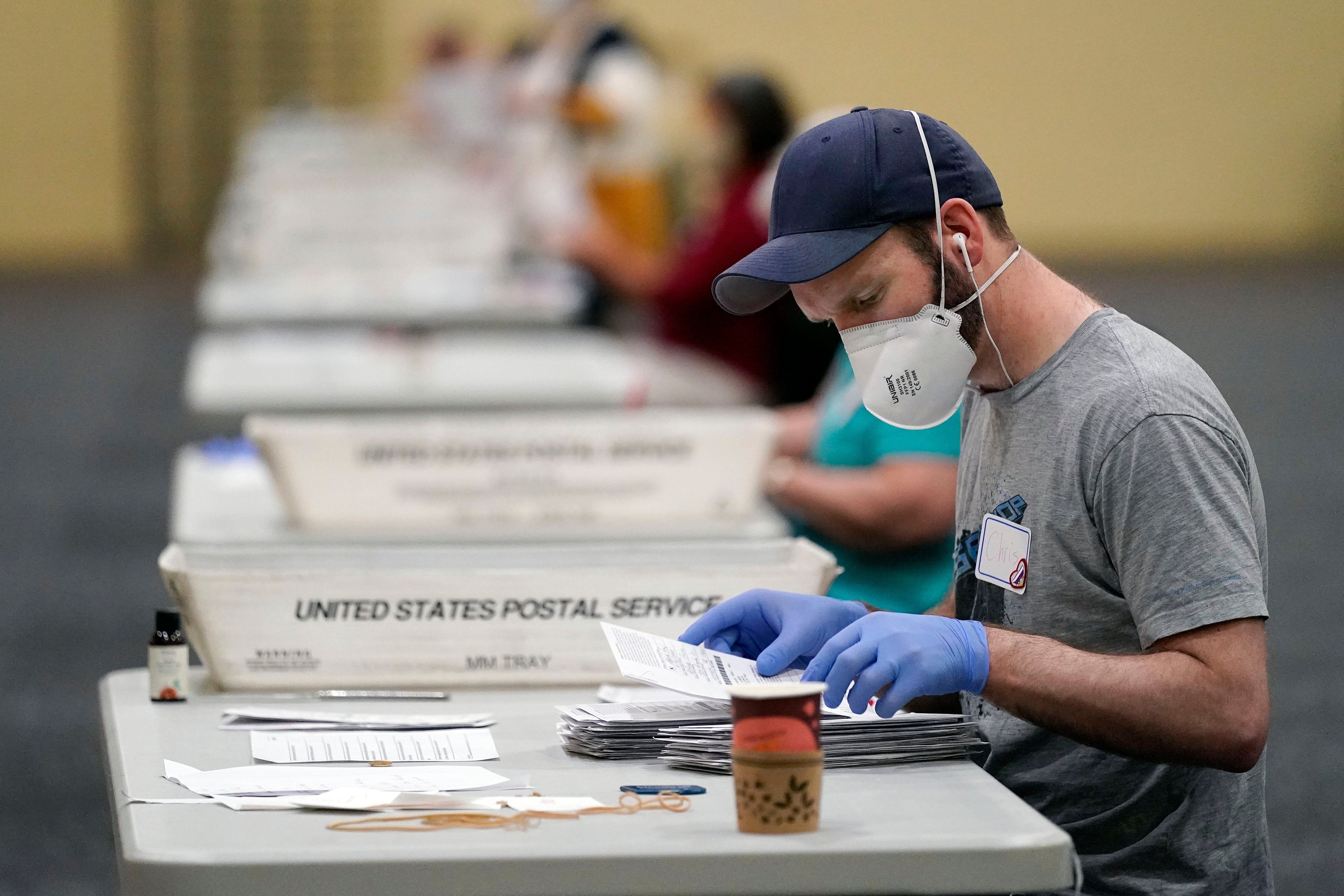 Poll workers in Pennsylvania count the ballots on Wednesday