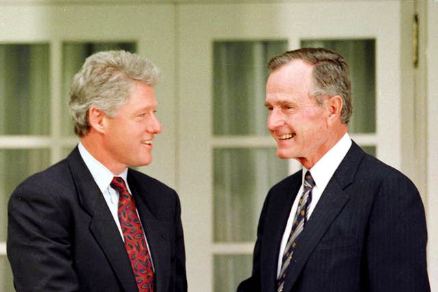 President George Bush shakes hands with President-elect Bill Clinton during a photo opportunity in the Rose Garden at the White House in this November 18, 1992 file photo.  REUTERS/Gary Hershorn-Files