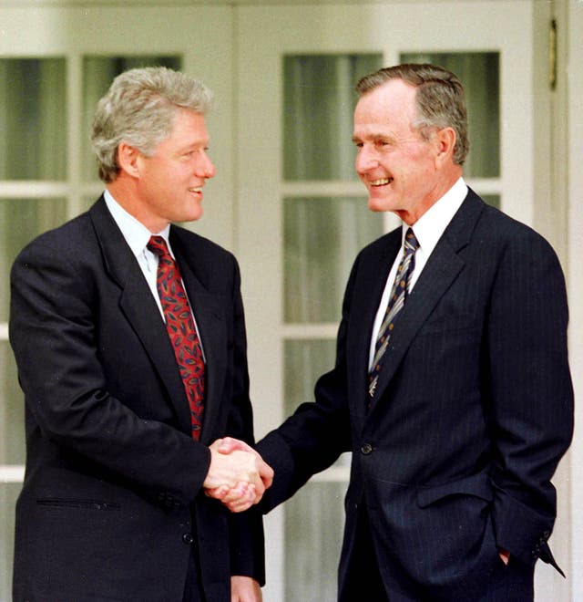 President George Bush shakes hands with President-elect Bill Clinton during a photo opportunity in the Rose Garden at the White House in this November 18, 1992 file photo.  REUTERS/Gary Hershorn-Files