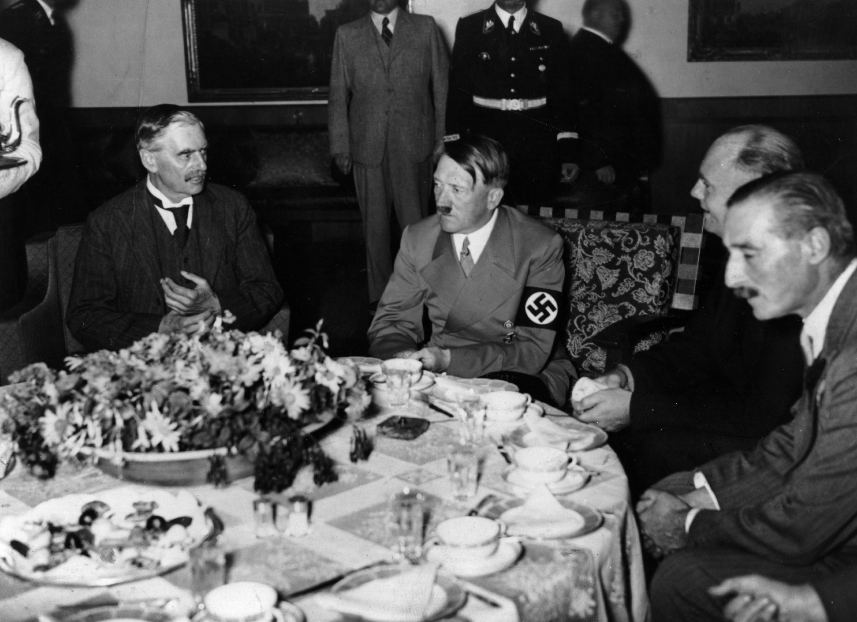 Chamberlain and Hitler at dinner during the former’s visit to Munich