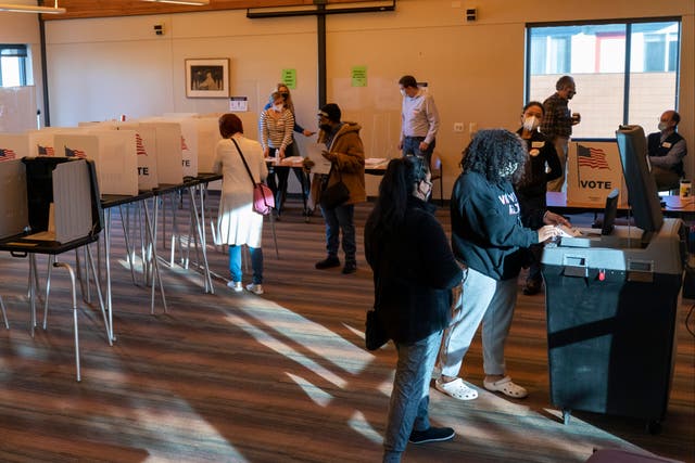 Voters cast ballots at the Catholic Multicultural Center on 3 November 2020 in Madison, Wisconsin