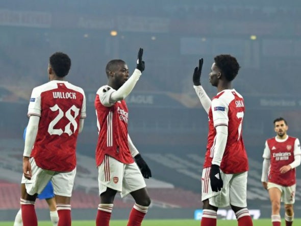 Nicolas Pepe celebrates scoring with Bukayo Saka