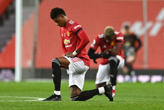 <p>Marcus Rashford of Manchester United takes a knee in support of the Black Lives Matter movement on 1 November</p>