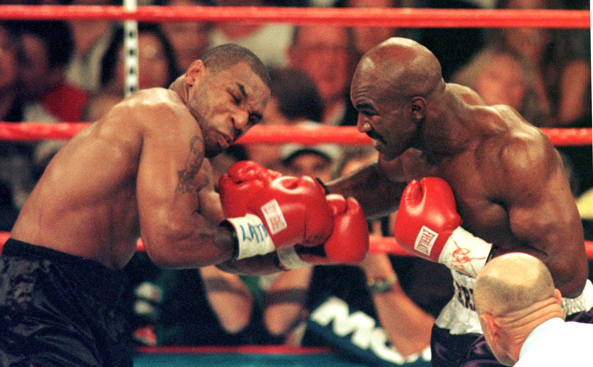 Mike Tyson, left, and Evander Holyfield were rivals