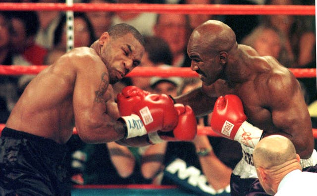 <p>Mike Tyson, left, and Evander Holyfield were rivals </p>