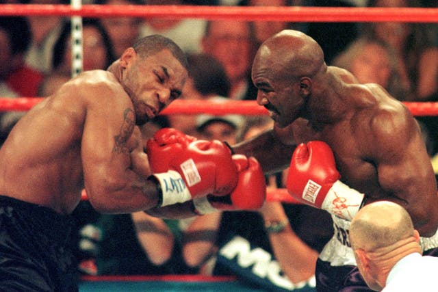 <p>Mike Tyson, left, and Evander Holyfield were rivals </p>