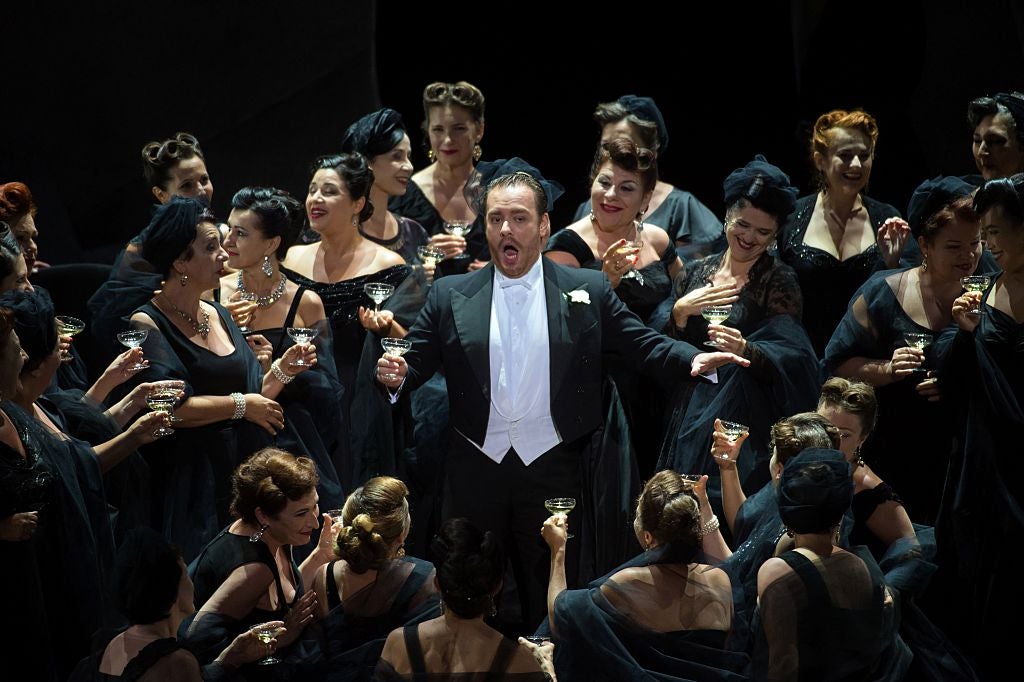 Italian tenor Francesco Meli (c), as Alfredo Germont, performs during the opera ‘La Traviata’ by Giuseppe Verdi
