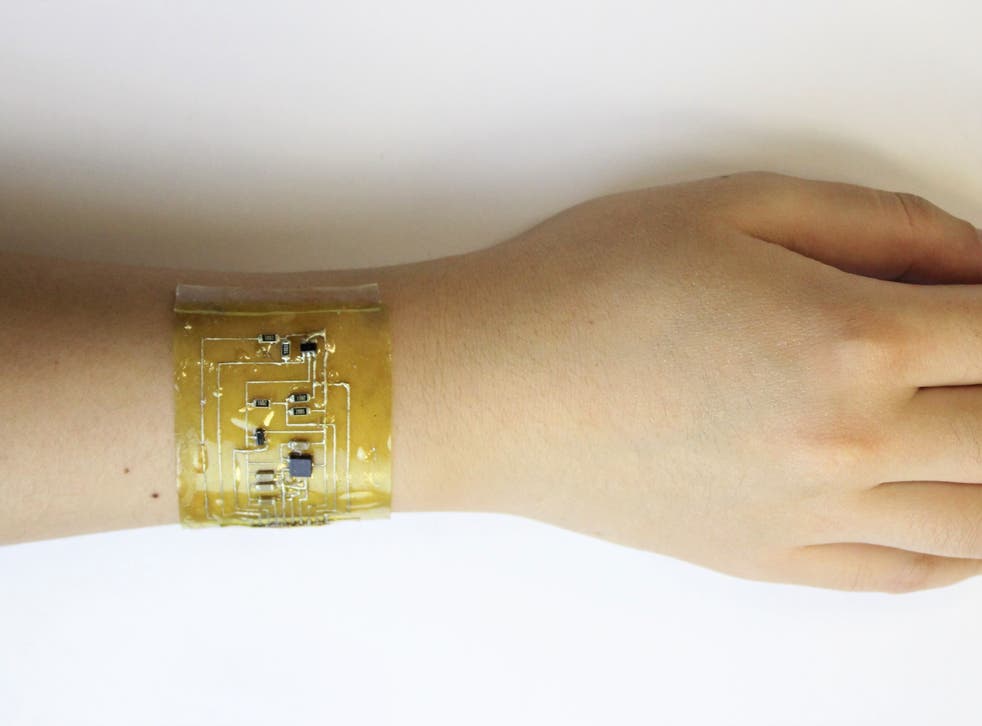 A person wears an ‘electronic skin' device on the wrist.
