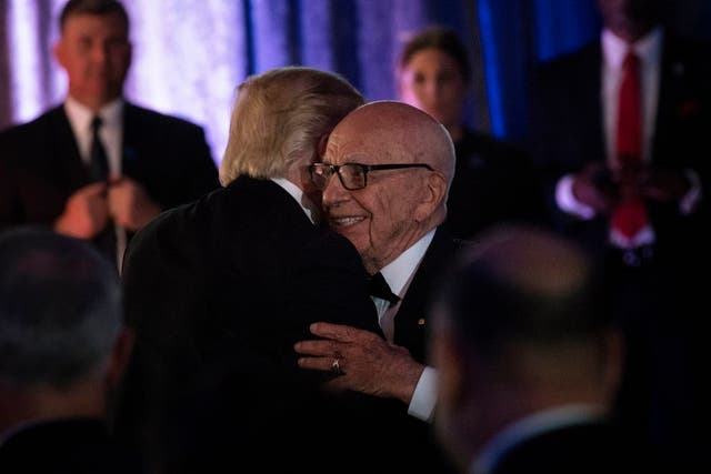 Rupert Murdoch and Trump embrace in 2017