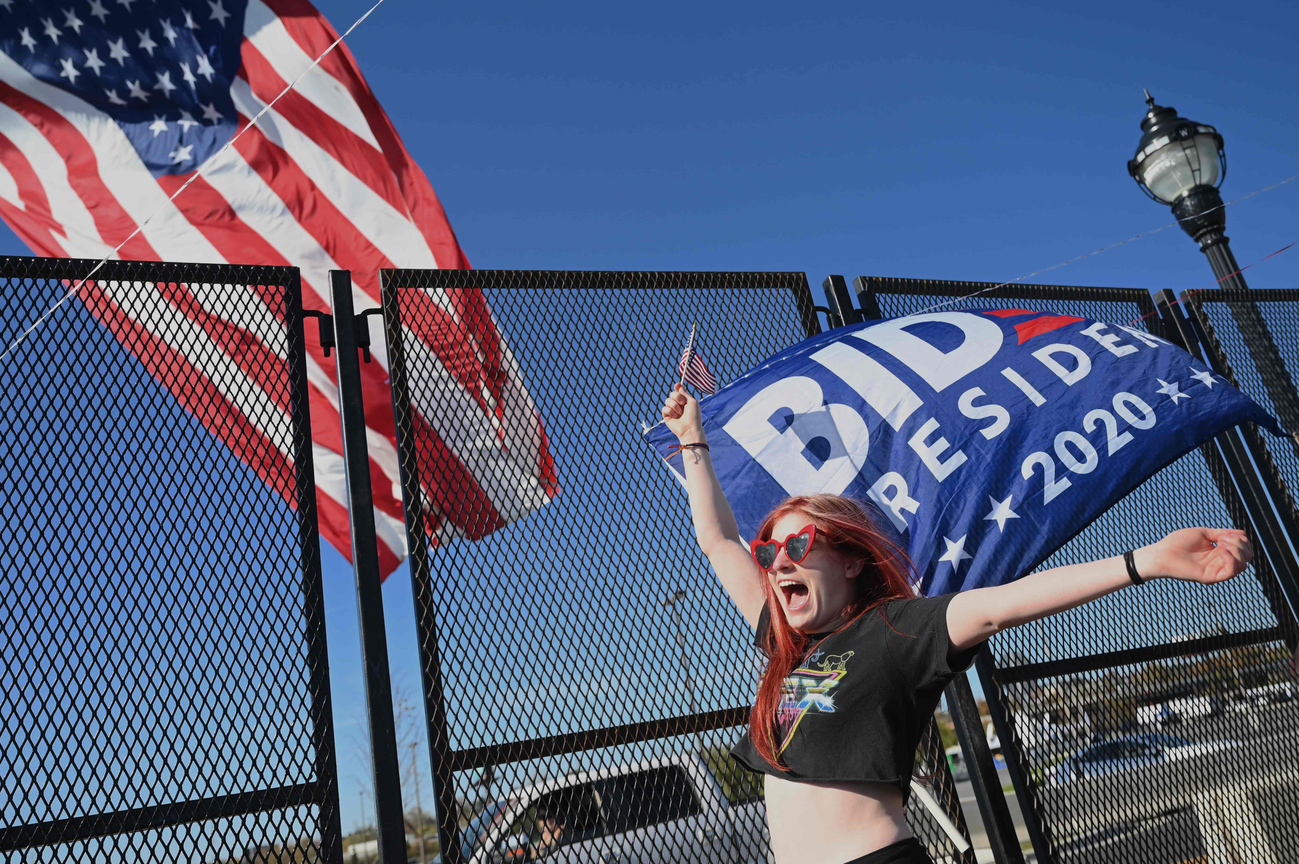 <p>Biden supporter cheers as she hears Joe Biden is the president elect in Wilmington, Delaware</p>
