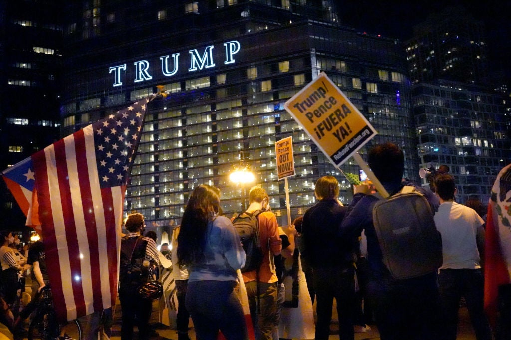 Supporters of president-elect Joe Biden celebrate near Trump Tower in Chicago