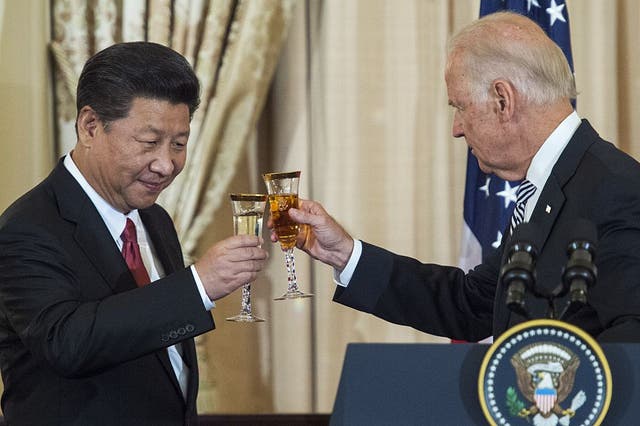 <p>Joe Biden and Chinese President Xi Jinping toast during a state luncheon for China in 2015</p>