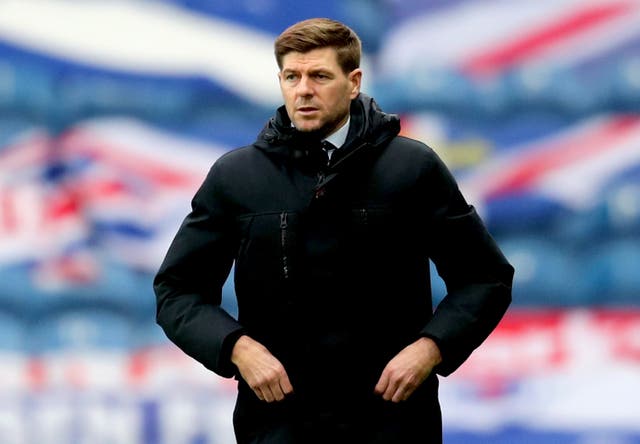 Steven Gerrard watches on from the touchline