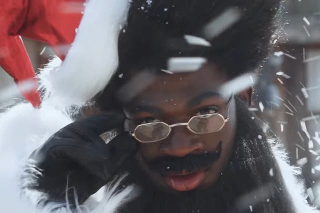 Lil Nas X dressed as Father Christmas in the teaser for ‘Holiday'