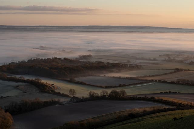  Mist lingers in the valley below Firle Beacon