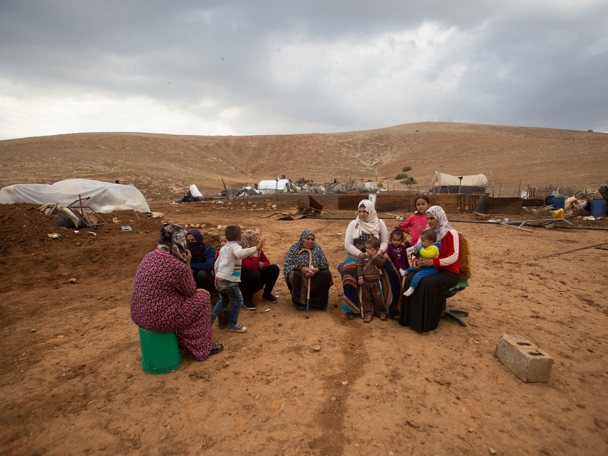 Palestinian women and children in Khirbet Humsu in Jordan Valley in the West Bank, 6 November, after Israeli bulldozers demolished their homes