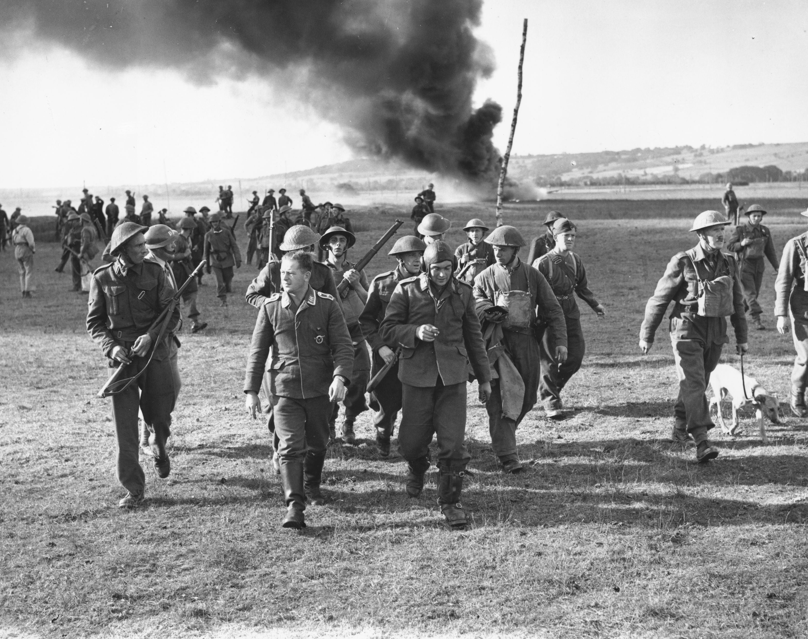 German airmen, who parachuted from a shot-down bomber are marched off by the Home Guard in Goodwood, Sussex