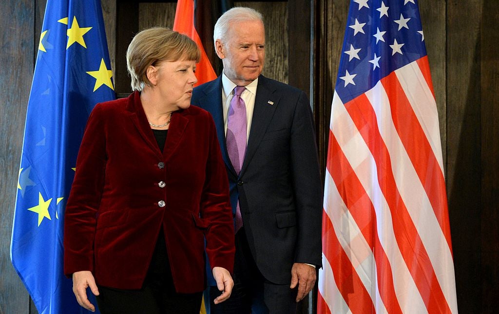 German chancellor Angela Merkel and former US vice president Joe Biden pose for photographers prior to their trilateral talks during the 51st Munich Security Conference &nbsp;in Munich, Germany, on 7 February, 2015