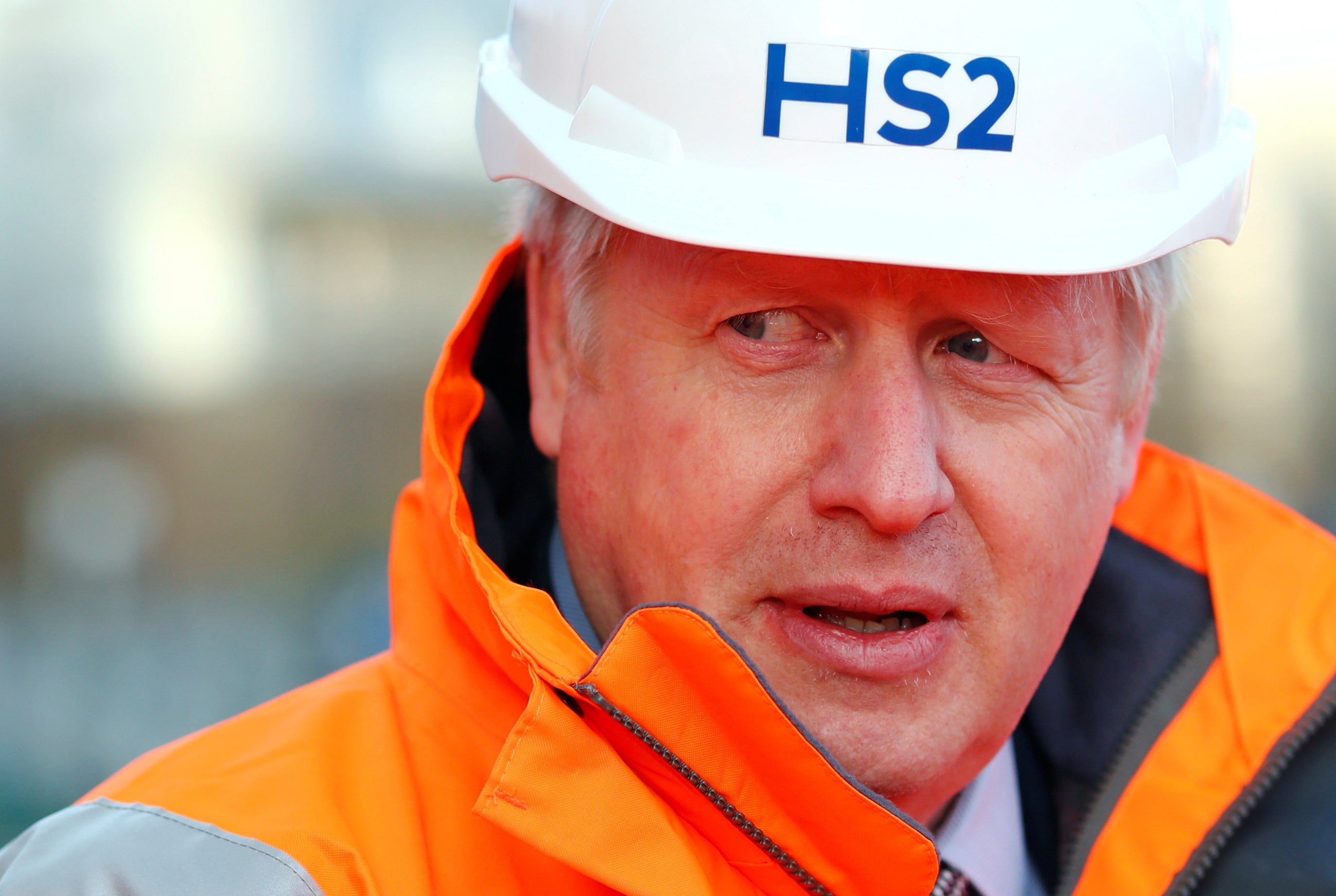 Boris Johnson looks on during a visit to an HS2 project site