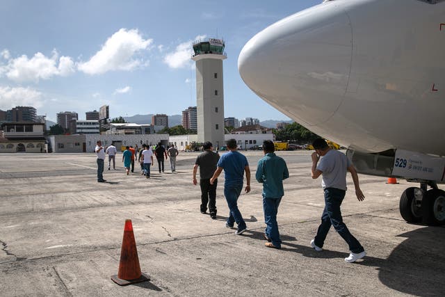 Guatemalan asylum seekers arrive on an ICE deportation flight from Brownsville, Texas on August 29, 2019 to Guatemala City. Immigration advocates warn that a group of Cameroonian asylum seekers facing deportation were physically forced to sign their own deportation orders.