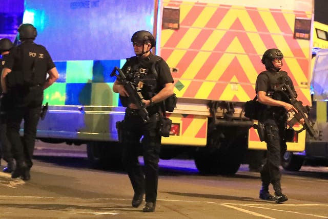 <p>Armed police close to the Manchester Arena after the terror attack at the Ariana Grande concert on 22 May 2017</p>