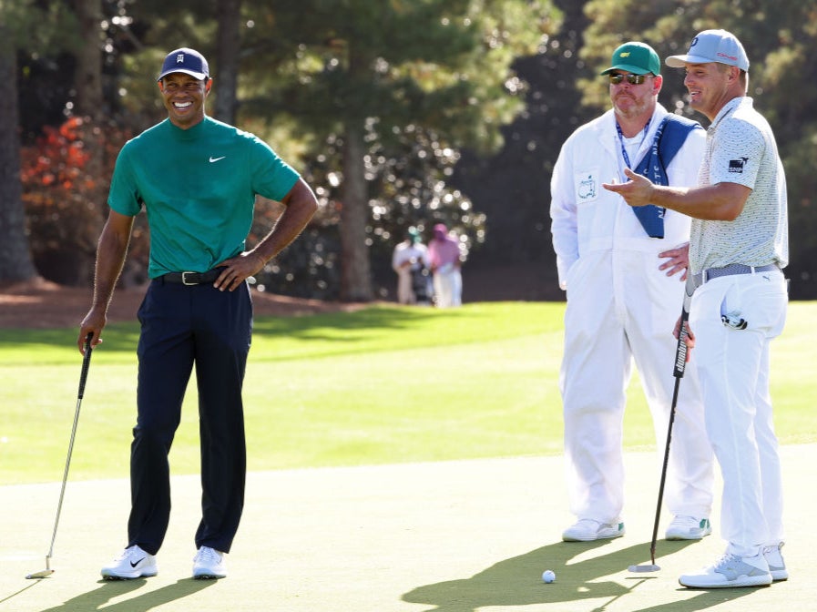 Bryson DeChambeau and Tiger Woods share a joke