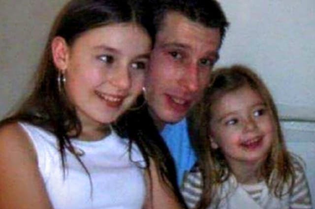 Robert Duff, who has been missing since 2013, pictured with his two daughters