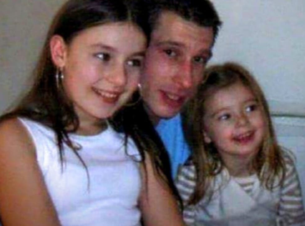 Robert Duff, who has been missing since 2013, pictured with his two daughters