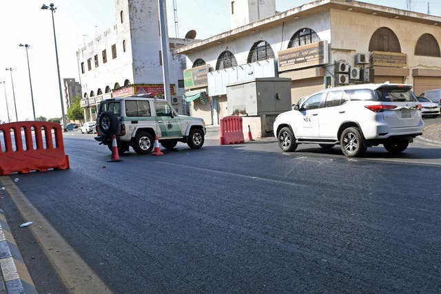 Police close off a street in Jeddah leading to the cemetery where the attack took place