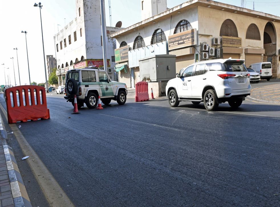 Police close off a street in Jeddah leading to the cemetery where the attack took place
