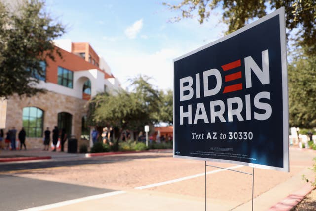 A campaign sign for Democratic presidential nominee Joe Biden is displayed outside of the Surprise Court House polling location