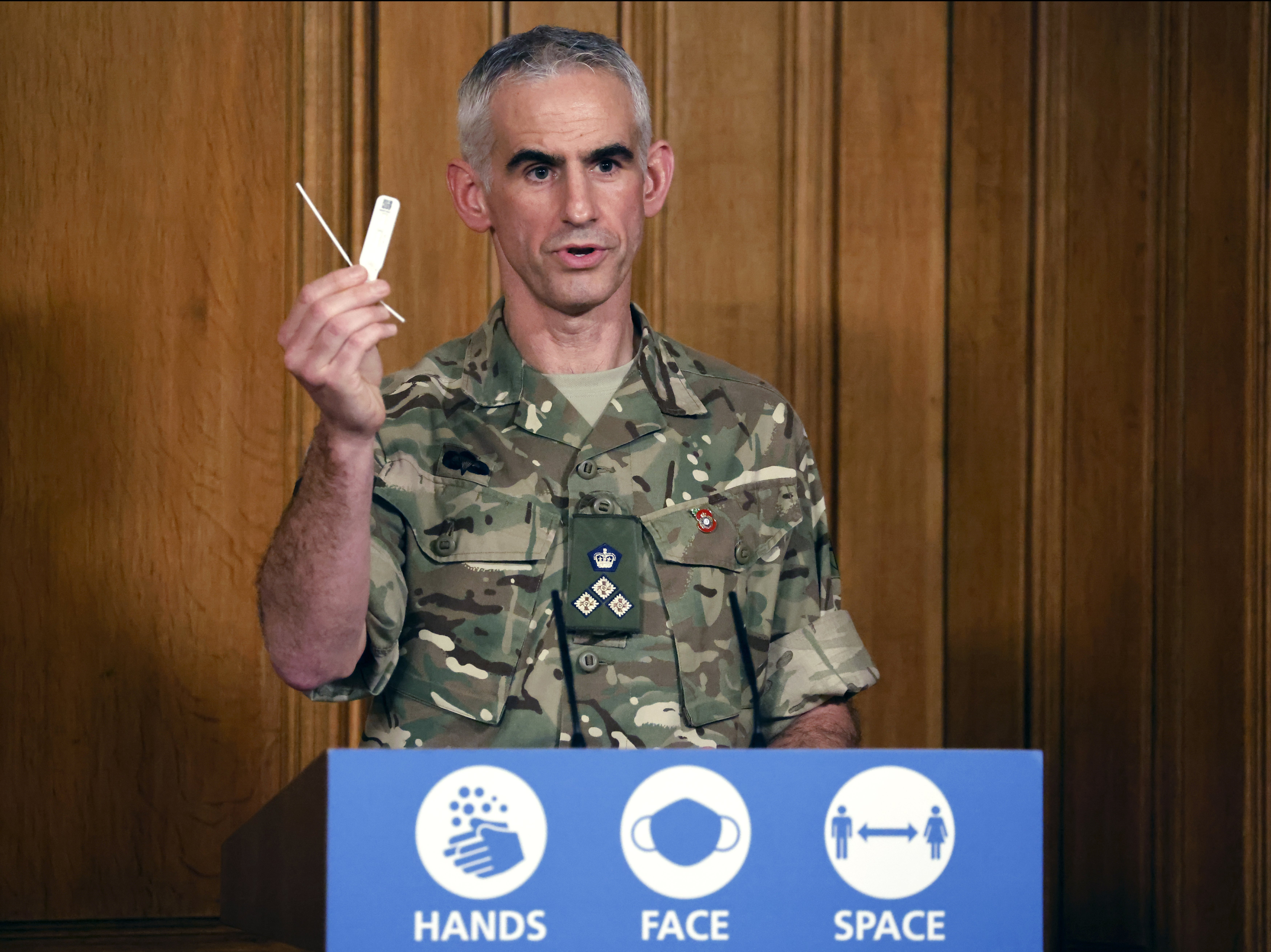 Brigadier Joe Fossey, who led the mass testing pilot in Liverpool, holds up a lateral flow Covid test during a Downing Street press conference