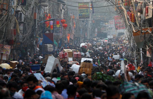 Shoppers crowd a market ahead of the Hindu festival of Diwali in Old Delhi on Tuesday